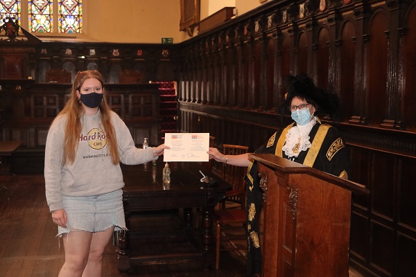 Lord Mayor of Exeter - Councillor Trish Oliver presents Florence Griffiths of Exeter College with her Exeter Yaroslavl Creative Writing Competition Certificate at Exeter Guildhall