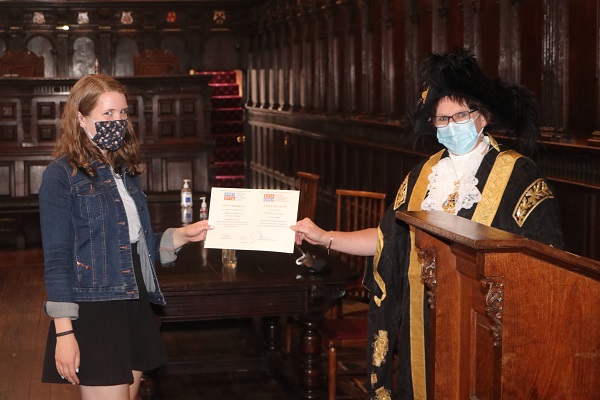 Lord Mayor of Exeter - Councillor Trish Oliver presents Rebekah McMillan of Exeter College with her Exeter Yaroslavl Creative Writing Competition Certificate at Exeter Guildhall