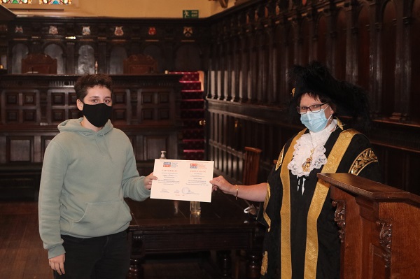 Lord Mayor of Exeter - Councillor Trish Oliver presents Lucy Roberts of Exeter College with her Exeter Yaroslavl Creative Writing Competition Certificate at Exeter Guildhall