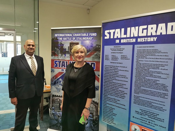 Councillor Abdul Salem Khan of Coventry City Council and Larkina  Ludmila.  Ludmila was a recipient of a Twin to Win award.  She represented London - Moscow twinning.  The board shows British cities that sent aid to the people of Stalingrad (now Volgograd) during the dark days of WWII, including Exeter. Photograph by Peter Barker — with Larkina  Ludmila at Coventry City Council.