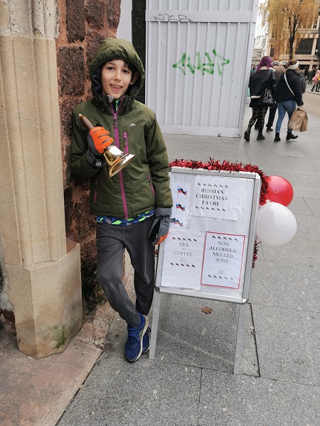 Leo our excellent bell-ringer.  In Exeter High Street, ringing up business for our Russian Christmas Fayre.