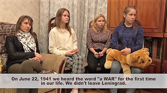 Young people at Solnechny Orphanage listen to Vera Nikolaevna's account